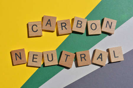 Carbon Neutral, words in wooden alphabet letters isolated on colourful background.の写真素材
