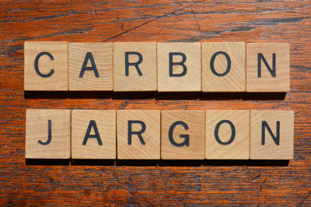 Carbon Jargon, words in wooden alphabet letters isolated on backgroundの写真素材