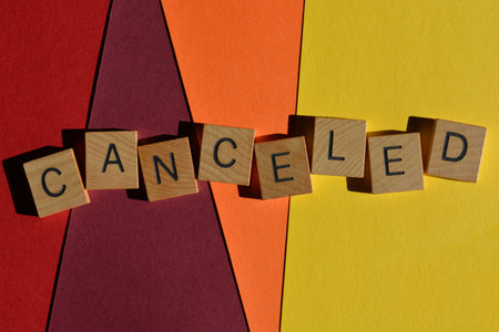Canceled, word in wooden alphabet letters isolated on backgroundの写真素材