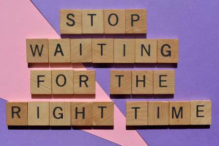 Stop Waiting For The Right Time, words in wooden alphabet letters isolated on backgroundの写真素材