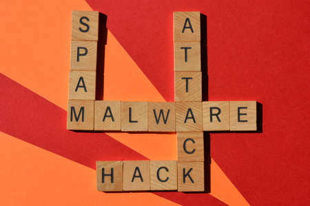 Malware, Hack, Attack, Spam, words in crossword isolated on colourful backgroundの写真素材