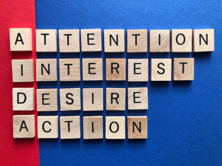 Business acronym AIDA, Attention, interest, desire, action, in 3d wooden alphabet letters on a red and blue backgroundの写真素材