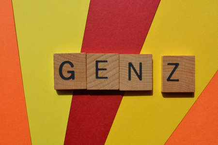 Gen Z, abbreviation for Generation Z, words in wooden alphabet letters isolated on brights and colourful backgroundの写真素材