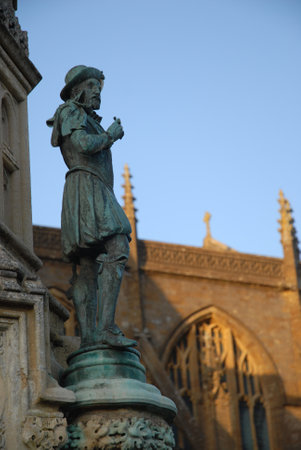 Statue of Sir Walter Raleigh on The Digby Memorial outside Sherborne Abbey, Dorset, Englandの写真素材