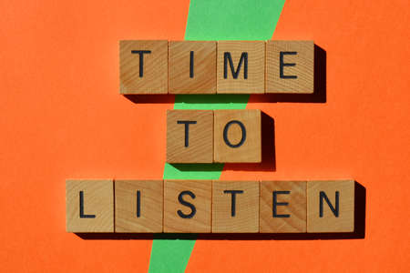 Time To Listen, words in wooden alphabet letters isolated on orange and green background