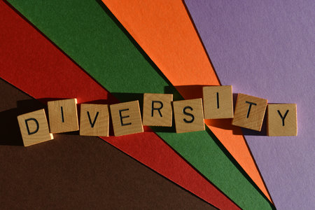 Diversity, word in wooden alphabet letters isolated on multicolour backgroundの写真素材