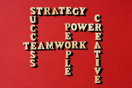 Strategy, Success, Teamwork, People Power, Creative, words in wooden alphabet letters in crossword form isolated on red backgroundの写真素材