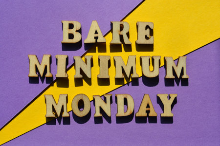 Bare Minimum Monday, words in wooden alphabet letters isolated on background