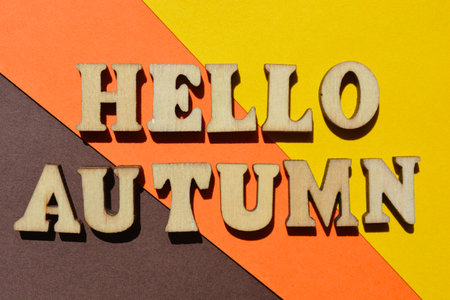 Hello Autumn, words in wooden alphabet letters isolated on backgroundの写真素材