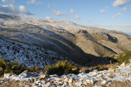 Winter landscape with snow in the mountains, Vall de Laguart,  near Benimaurell, Alicante Province, Spainの写真素材