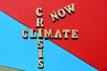 Climate Crisis Now, words in wooden alphabet letters in crossword form isolated on background
