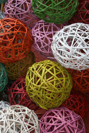 display of wicker balls in different coloursの写真素材