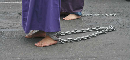 Quito, Ecuador - March 29, 2013: Chained feet of a penitent at the Good Friday procession のeditorial素材