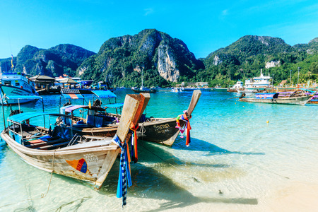 PHI-PHI ISLAND, KRABI, THAILAND - NOVEMBER 10, 2016: Longtrail boats on port, Koh Phi Phi Don in andaman sea, Phuket, Krabi, South of Thailand.のeditorial素材