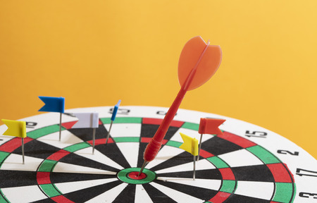 Red Dart arrow in the target center, business goal concept. The goal of business is intended to accomplish as a team go together to the final.の写真素材