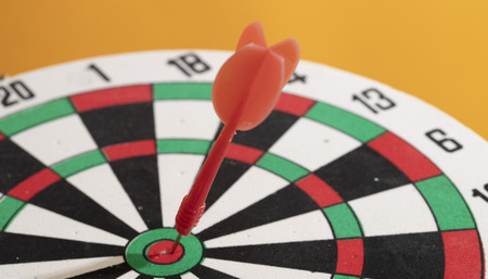 Red Dart arrow in the target center, business goal concept. The goal of business is intended to accomplish as a team go together to the final.の写真素材