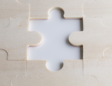 missing puzzles on a wooden background. Concept business. Idea: working in a team. Close up.の写真素材