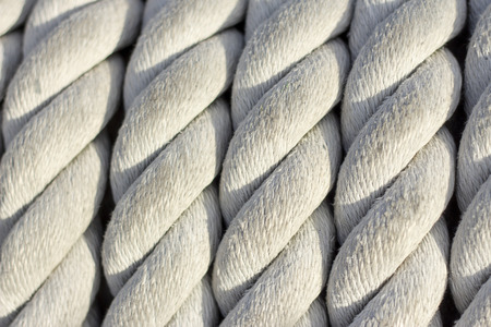 Close-up of old frayed boat rope as a background in war ship