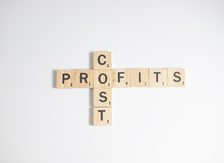 Bangkok, Thailand, October 22, 2018 - Scrabble letters spelling the word cost and profits, Business...