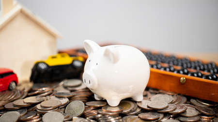 If you want to buy house and cars you must plan for saving money for this and must collect every month like you do for your businessの写真素材