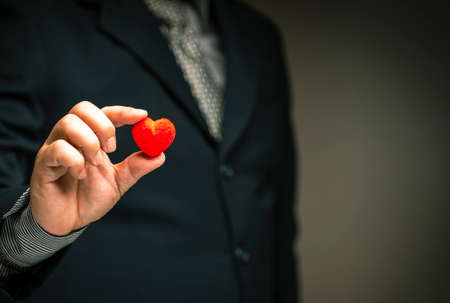 Service satisfaction concept, rated positive satisfaction.business man give Highest service ratings with red heart.の写真素材