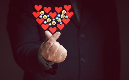 Businessman doing mini heart hand giving highest satisfaction rating red heart smiley face thumb up thumbs up Service Provider Satisfaction Conceptの写真素材