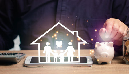 Man putting money into a savings piggy bank. concept of savings. Save money for the future of the family, borrowing, buying goods, borrowing funds, loan.の写真素材