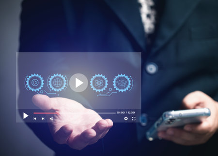 Course on demand concept. User holding a virtual screen in his hand with various courses to choose from online, e-learning, education, music, technology, industry. Cloud computing.の写真素材