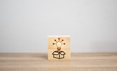 business idea concept. Light bulb, red arrow and many icon on wooden board. Icon Business success and new strategy. Industry. Medicine, engineer. Financial.の写真素材