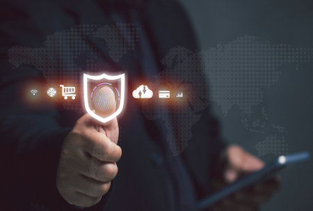 online security concept. Businessman scans his fingerprints to verify his/her identity with the system to conduct transactions in various fields, finance, banking, industry, engineering.の写真素材