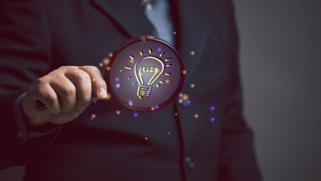 business idea concept. businessman using magnifying glass to search for ideas in work. brainstorming...