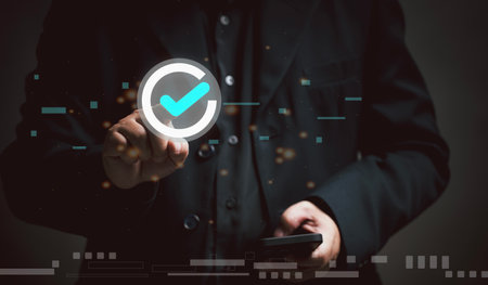 Businessman use mobile for list quality assurance and service. Test for evaluating the quality of products, organizations, manufacturing industries and online services. Doing questionnaires satisfaction.の写真素材