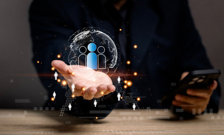 Customer Relationship Management, Businessman use mobile application to search employment  and hiring for interview job description for organization. Staff recruitment. Team success.の写真素材