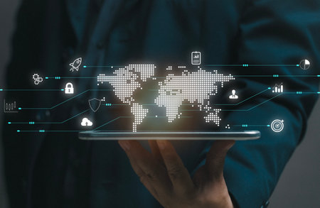 Businessman uses virtual screen with world map and icons in hand. Business global internet connection technology and digital marketing, Financial and banking, Digital link tech, big data.の写真素材