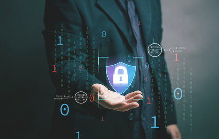The concept of cyber security. Businessman holds shield symbol and key for online security. data privacy. Protecting corporate and personal information. System network identity theft by hackers.の写真素材