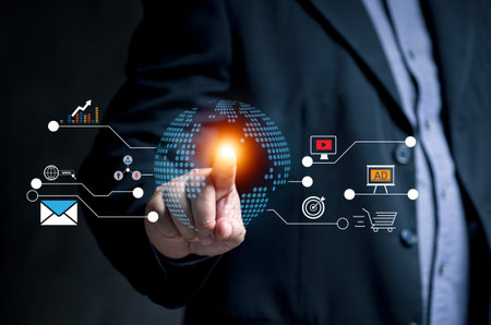 marketing in the global digital, man pointing at the globe through a virtual screen. To set a...