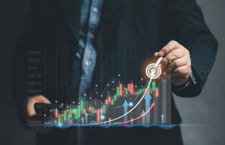 A businessman decides to buy and sell stocks online through the virtual screen of his mobile phone. planning and strategy, Stock market, Business growth, progress or success concept. Financial currency.の写真素材