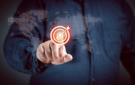 Businessman points out goals, sets guidelines for global marketing strategy at virtual screen. Business achievement growth performance development and investment. New opportunity. Financial target.の写真素材