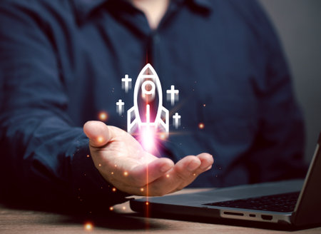 man shows a flying rocket in his hand. New businesses that have just started and are taking off from the beginning. Startup business, idea for success, strategy marketing for innovation. Creativity.の写真素材