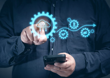 A man uses a mobile phone to order tasks to check carbon climate sustainable on the virtual screen. Eco earth environment and pollution change. Global economy renewable strategy in future.の写真素材
