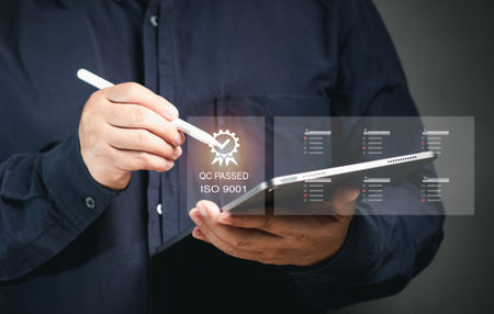 Businessman holding pen and showing the best quality assurance for guarantee product and ISO service concept. Customer survey feedback. Client Questionnaire for service.の写真素材