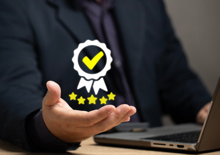 Businessman holding and showing the best quality assurance with golden five stars for guarantee product and ISO service concept. Customer survey feedback. Client Questionnaire for service.の写真素材