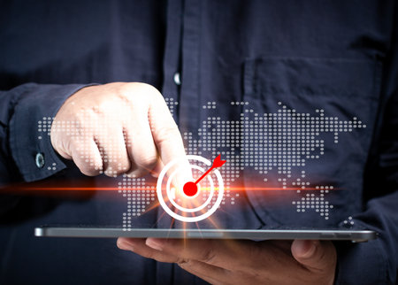 Business Man holding tablet pointing at marketing target. Business and marketing targets plan. Focus strategy idea target growth achievement. Business goal competition management.の写真素材