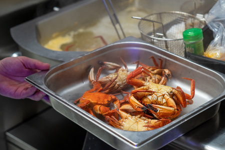 Several crabs cooked in a restaurant kitchen. Cooking and food concept.の写真素材