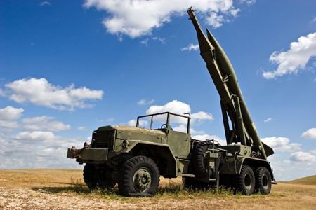 Military truck in desert-like surroundingsの写真素材
