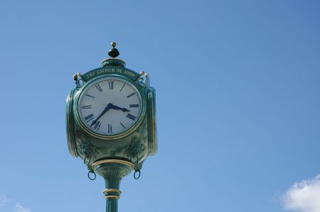 Town clock with blue sky background