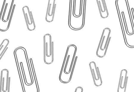 Metal paper clips background on white isolateの写真素材
