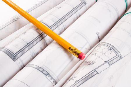 Plans of a  designed by an architect with a yellow pencil