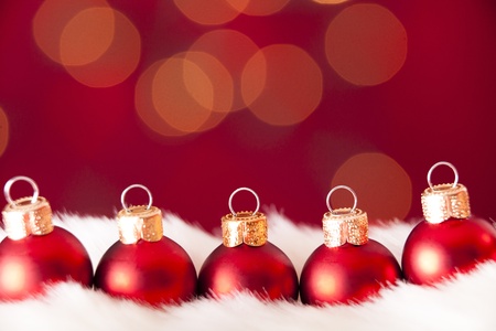 Red baubles on a red and luminous backgroundの写真素材