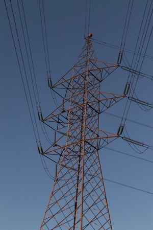 Big cable telephone antenna in front of blue skyの写真素材